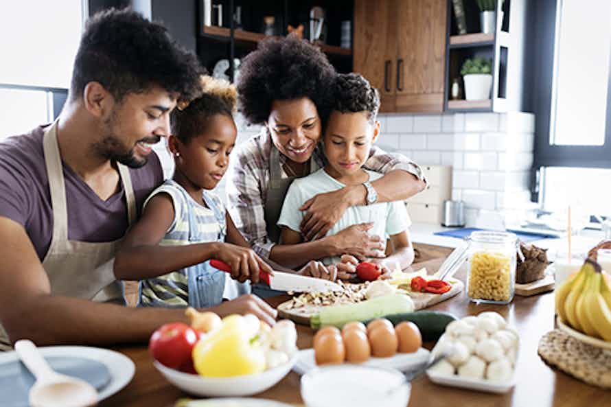 A family sharing a healthy meal for diabetes management.